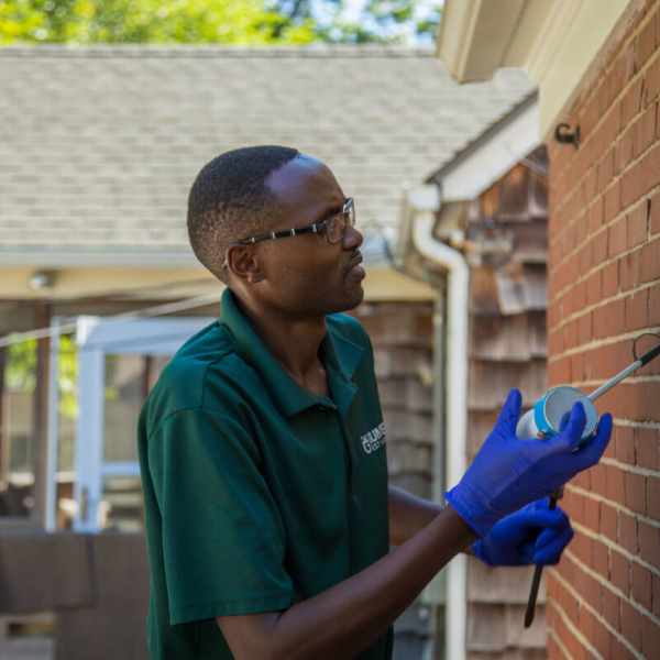 Pest Control SEO Case Study. Gunter Pest & Lawn exterminator doing his job.