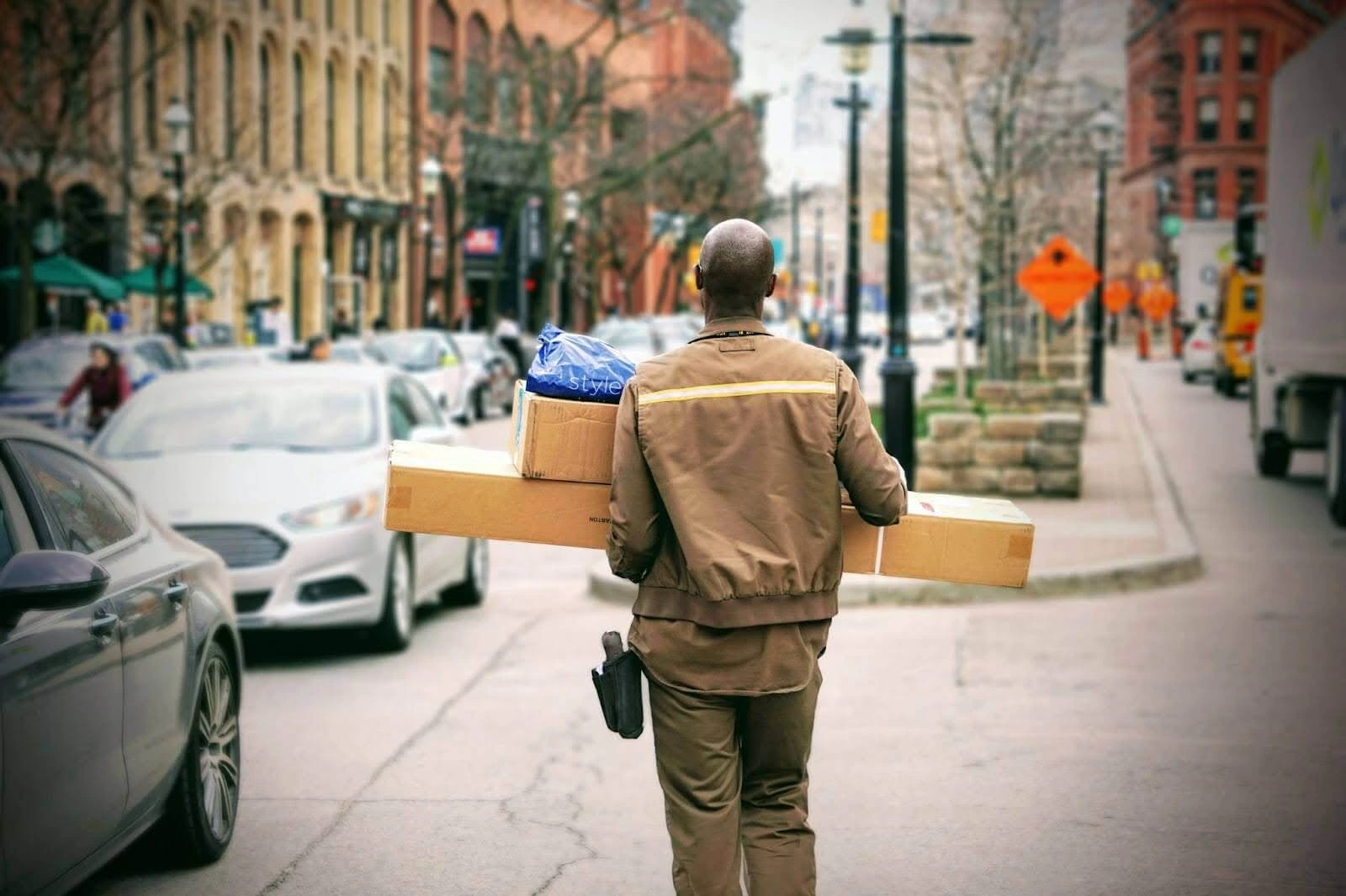 A delivery worker moving packages