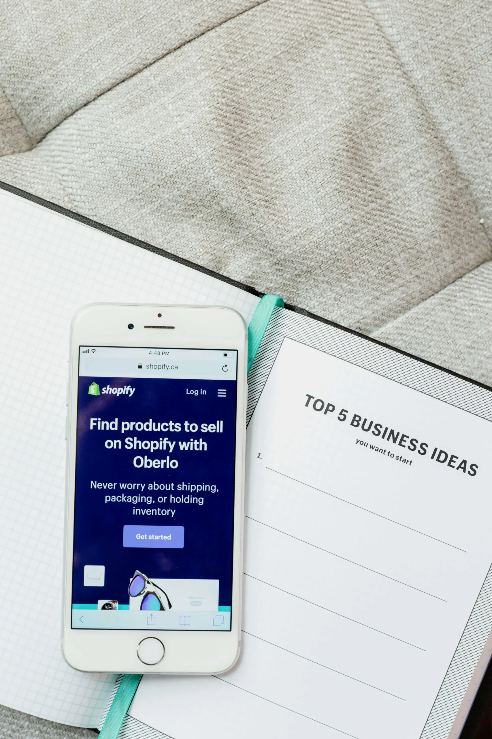 A phone with shopify open