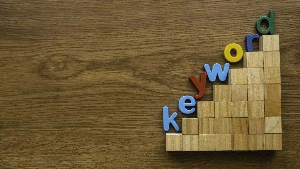 Keyword Research | Matchbox Design Group Colorful alphabet of word keyword on a ladder of wooden cube.