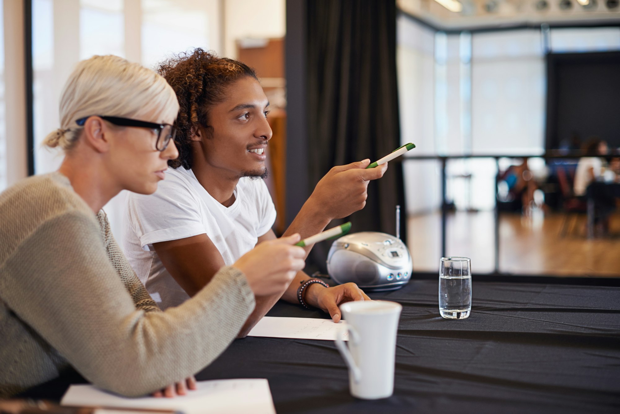 SEO Features To Look For In A CMS: A Buyer's Guide. Workers looking at features.