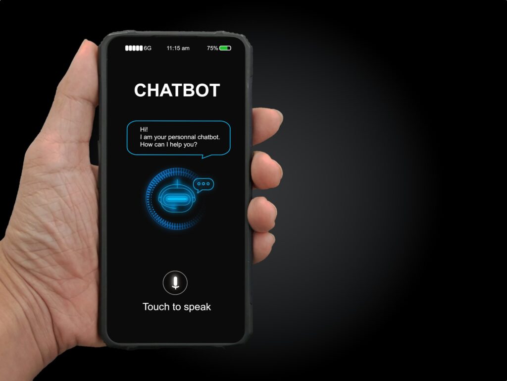 A man's hand holding mobile smartphone with chatterbot application | Matchbox Design Group Business messaging.